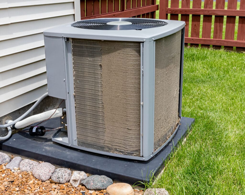 Dirty condenser Coils being cleaned as a routine system maintenance